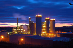 Biomass energy facility with boilers, piping, and steam turbines.