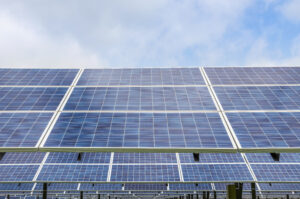 Close up rows array of polycrystalline silicon solar cells or photovoltaic cells in solar power plant turn up skyward absorb the sunlight from the sun